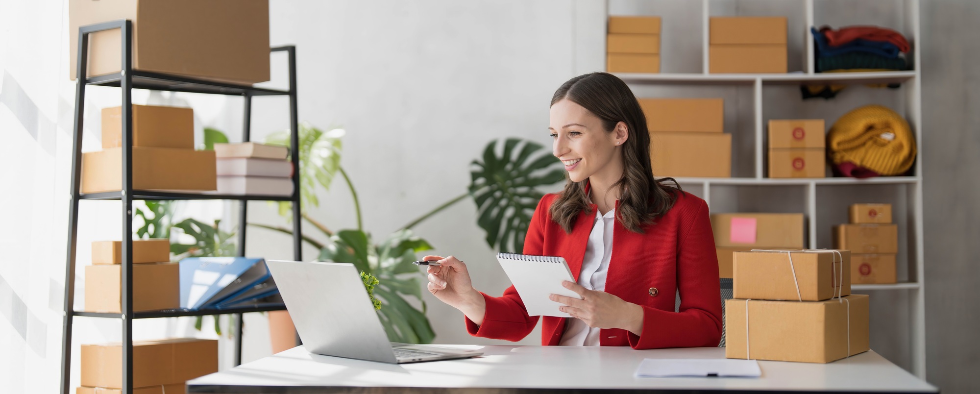 Portrait business woman smile and use tablet checking information on parcel shipping box